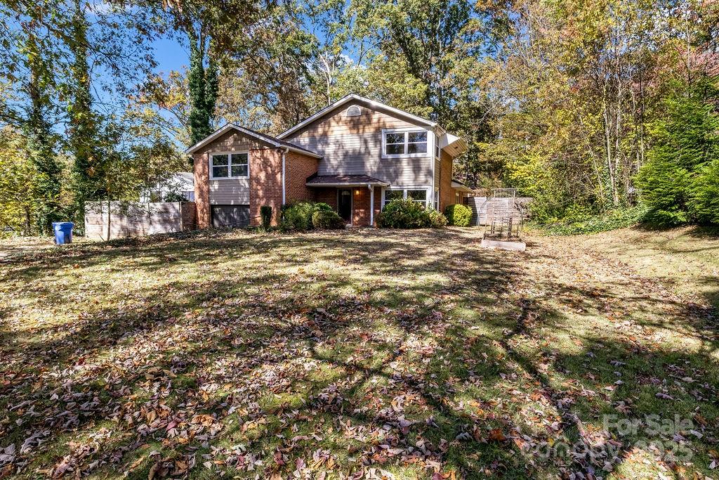 145 Beverly Road Asheville, NC 28805 - Photo 37 of 45 a front view of a house with a yard