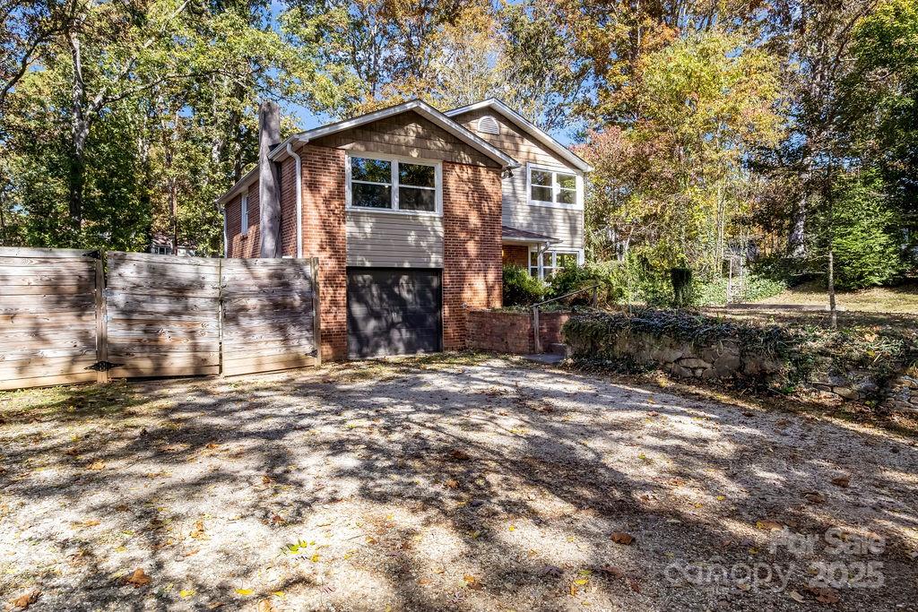 145 Beverly Road Asheville, NC 28805 - Photo 38 of 45 a view of a house with a yard