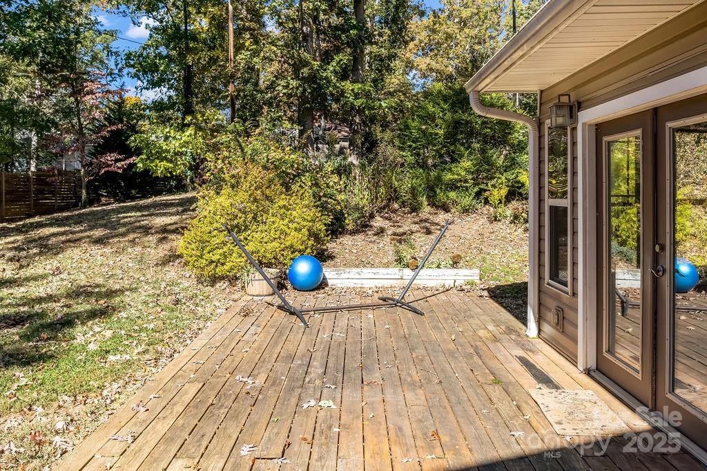 145 Beverly Road Asheville, NC 28805 - Photo 39 of 45 a view of empty room with wooden floor and fence