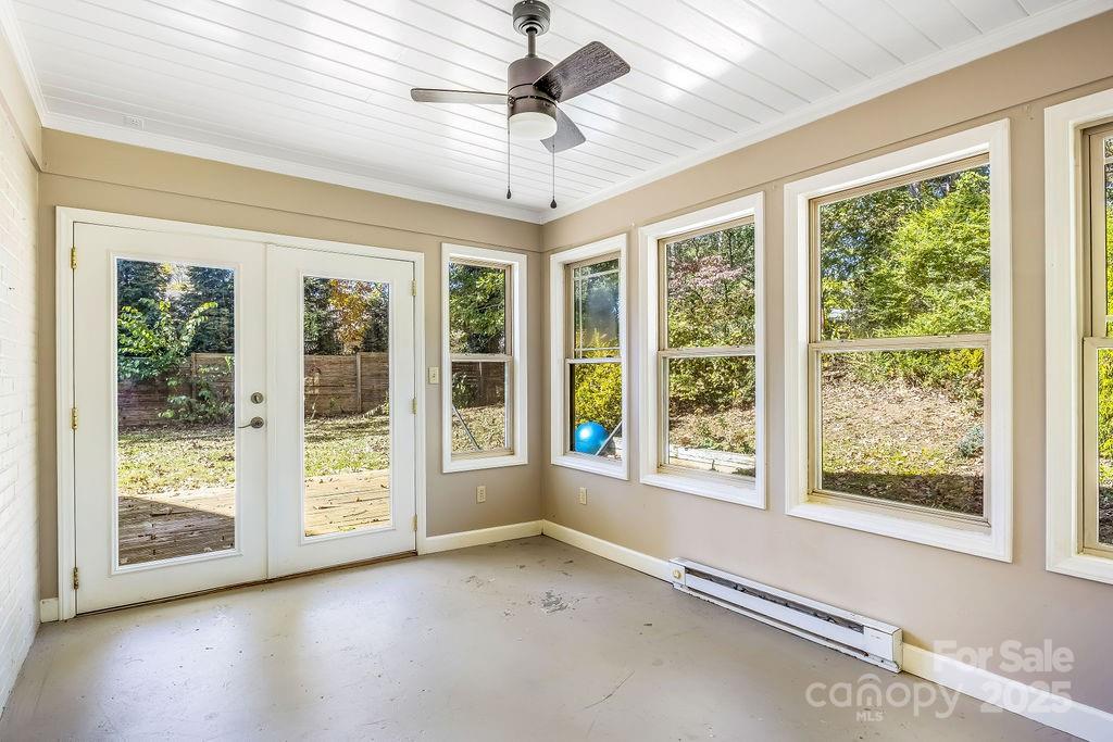 145 Beverly Road Asheville, NC 28805 - Photo 6 of 45 a view of room with window and ceiling fan