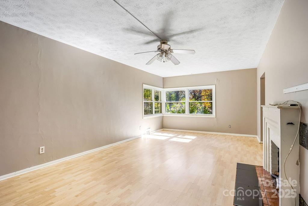 145 Beverly Road Asheville, NC 28805 - Photo 7 of 45 a view of an empty room with a window