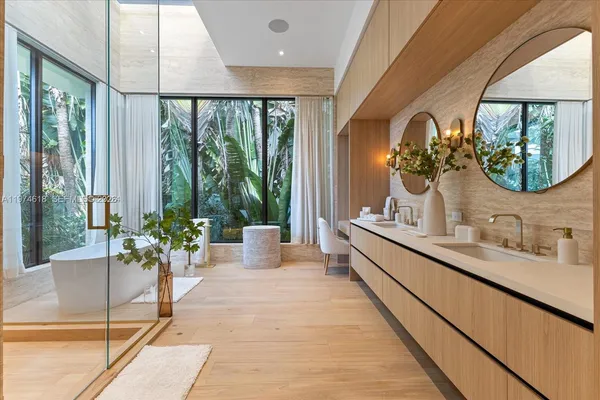 a lobby with a large window and potted plant