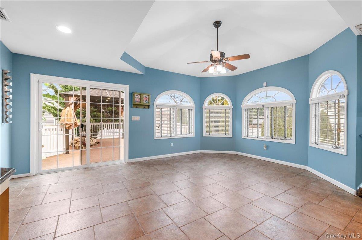 Undisclosed Address Bellmore, NY 11710 - Photo 14 of 30 a view of entryway with chandelier