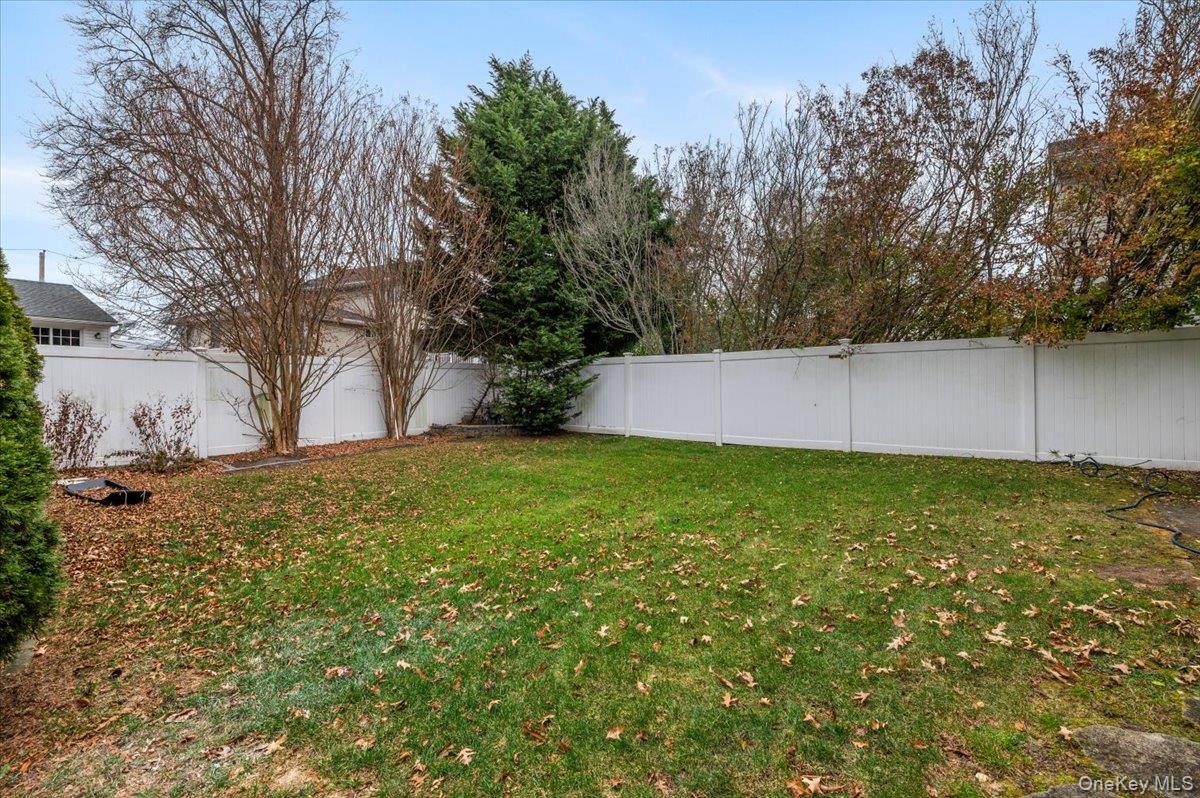 Undisclosed Address Bellmore, NY 11710 - Photo 30 of 30 a view of a backyard