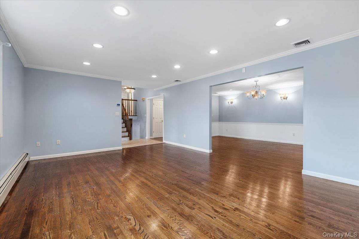 Undisclosed Address Bellmore, NY 11710 - Photo 5 of 30 a view of empty room with wooden floor