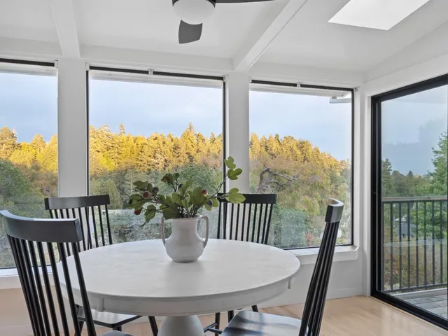 a kitchen with granite countertop white cabinets and stainless steel appliances