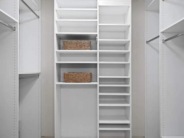 a view of living room with furniture and potted plant
