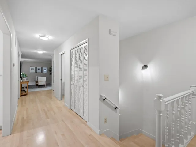 a bedroom with a bed and a mirror