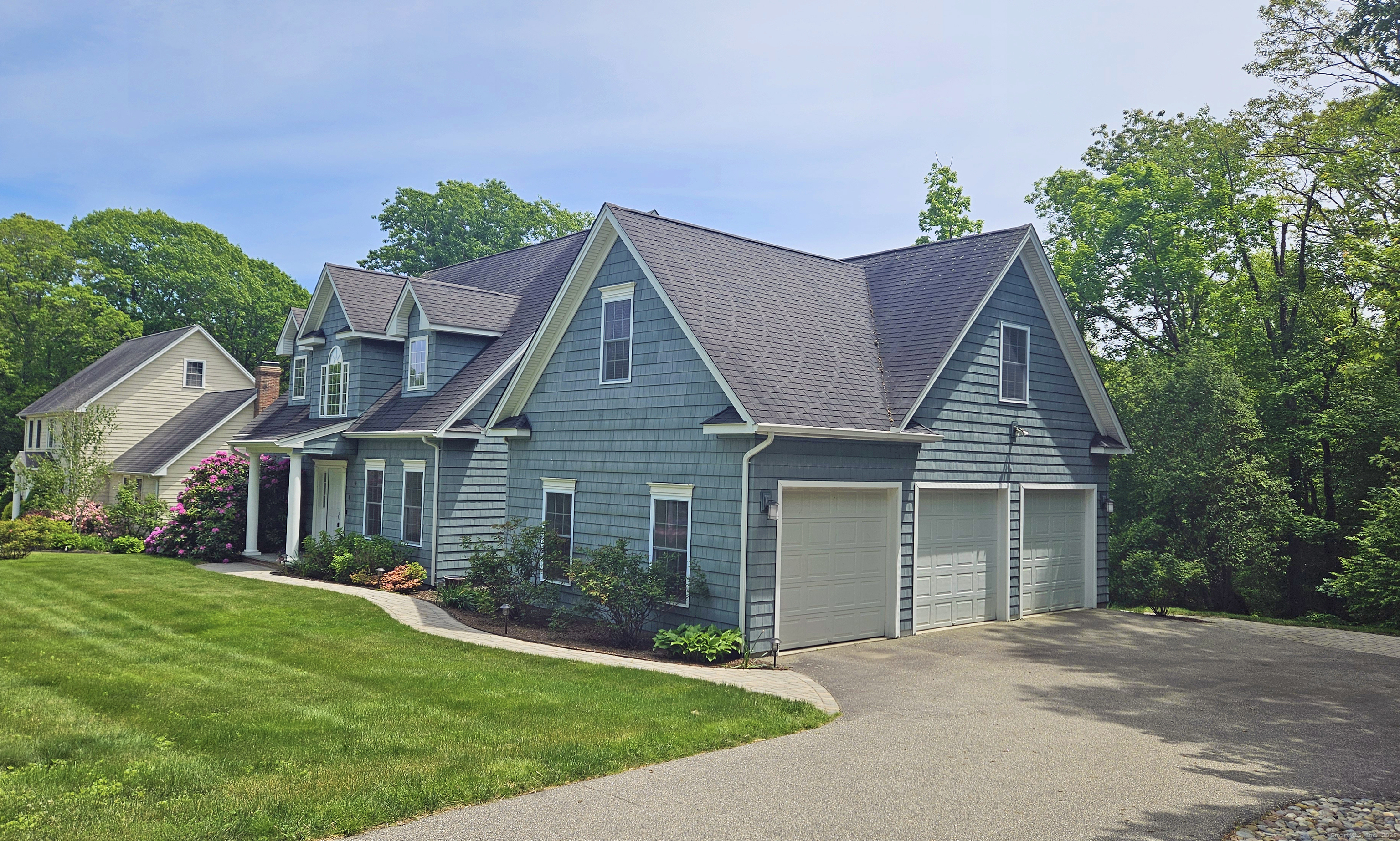 front view of a house with a yard