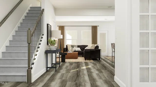 a view of living room with furniture and floor to ceiling windows