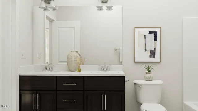 a bathroom with a sink vanity and a toilet