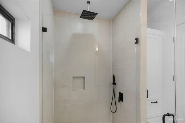 a bathroom with a granite countertop sink and a toilet
