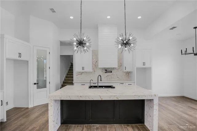 a bathroom with a sink double vanity and a mirror