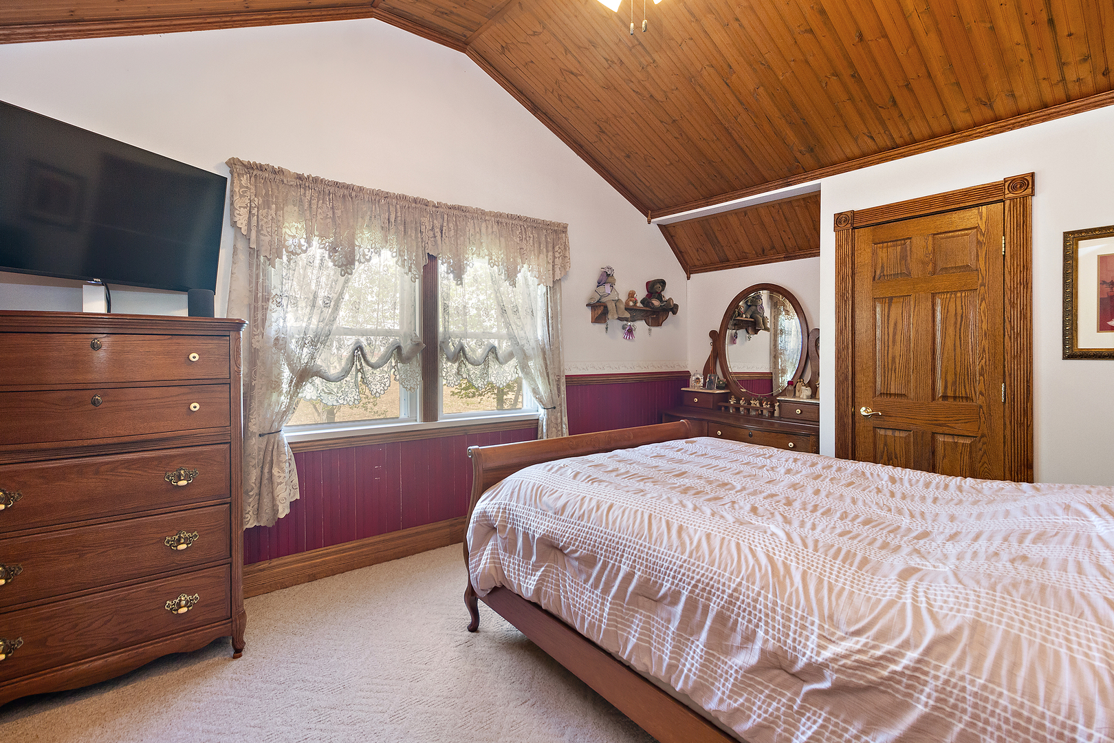 10045 North 17500E Road Grant Park, IL 60940 - Photo 12 of 17 a bedroom with a bed and a flat screen tv