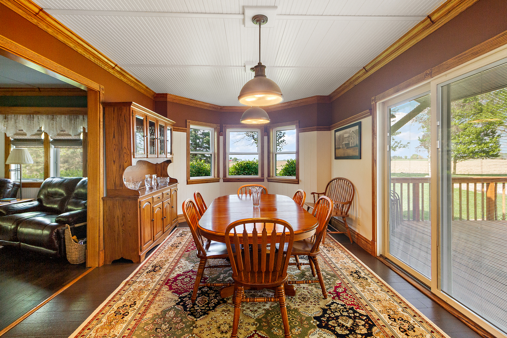 10045 North 17500E Road Grant Park, IL 60940 - Photo 5 of 17 a dining room with furniture a chandelier and wooden floor