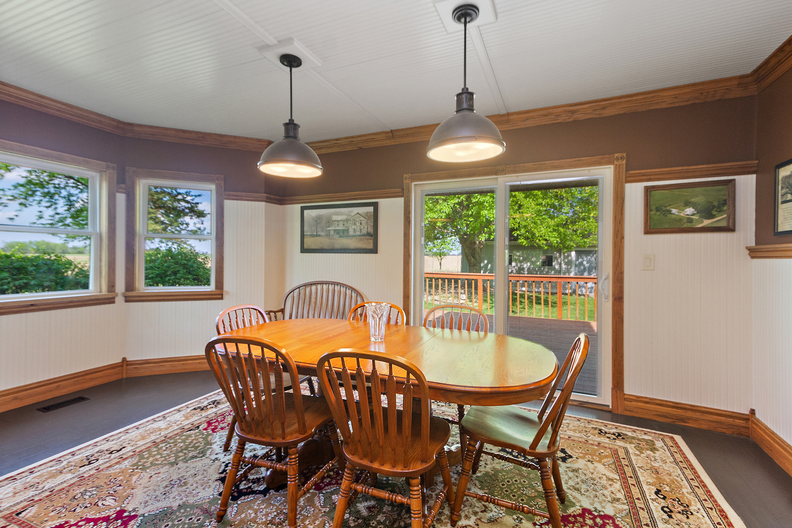 10045 North 17500E Road Grant Park, IL 60940 - Photo 6 of 17 a dining room with furniture a chandelier and wooden floor