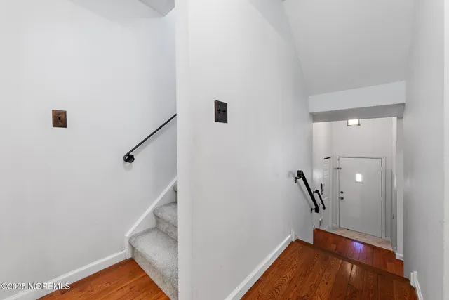a view of entryway with wooden floor