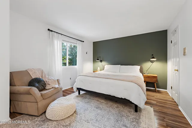 a bedroom with a bed and a couch