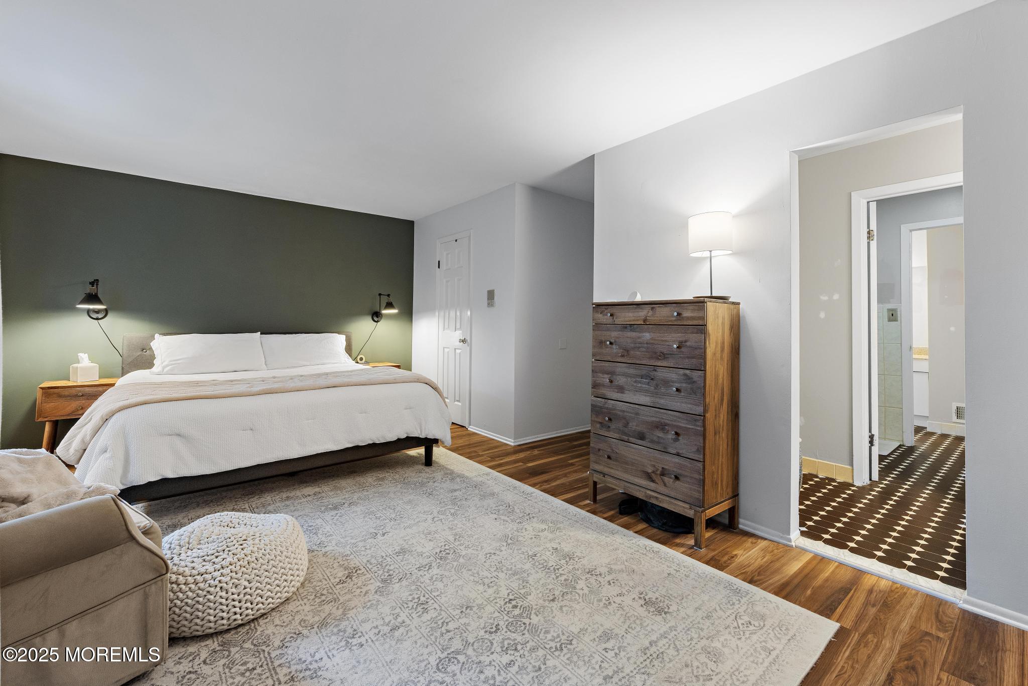 343 Middlewood Road Middletown, NJ 07748 - Photo 21 of 30 a bedroom with a bed and wooden floor