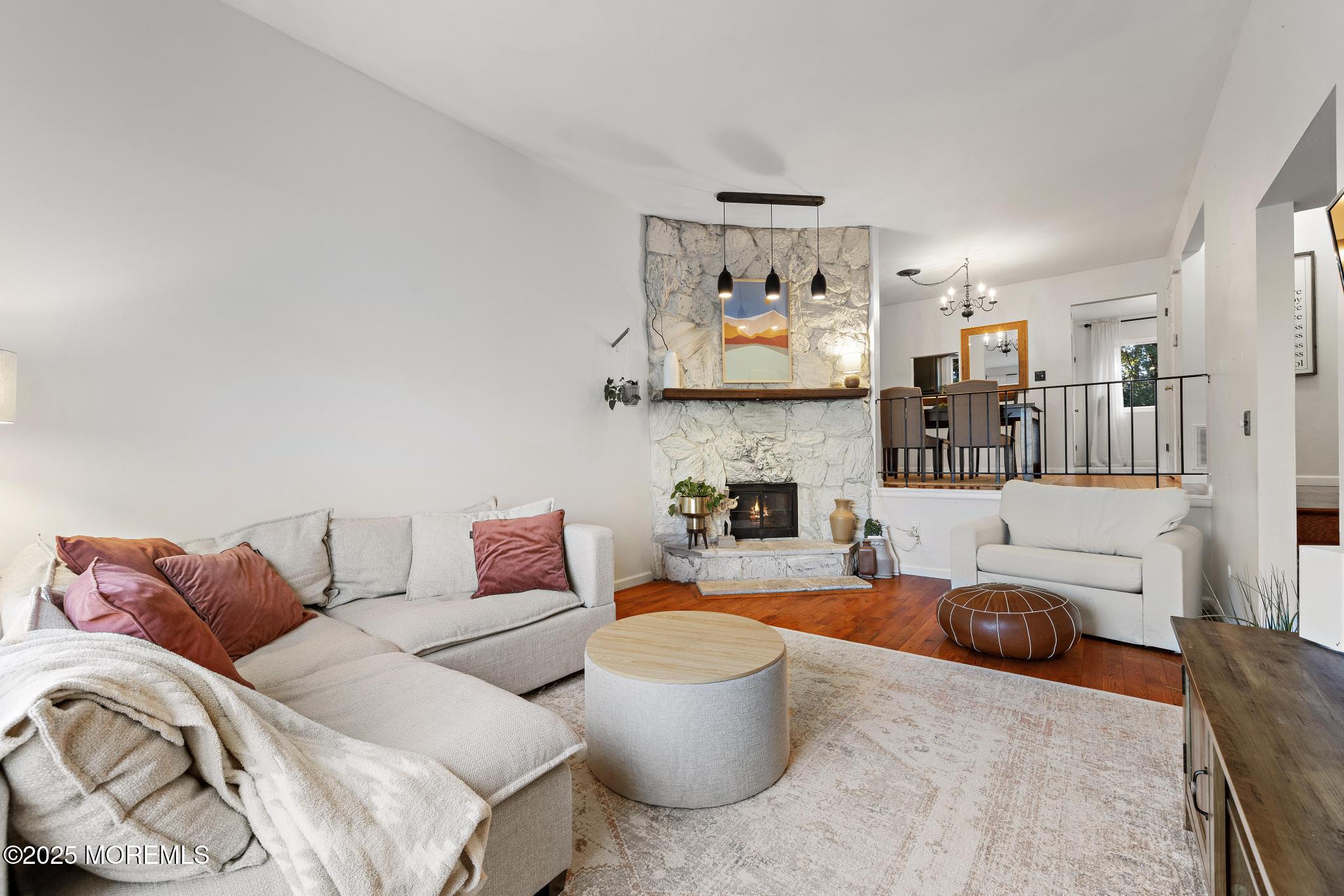 343 Middlewood Road Middletown, NJ 07748 - Photo 3 of 30 a living room with furniture and a flat screen tv