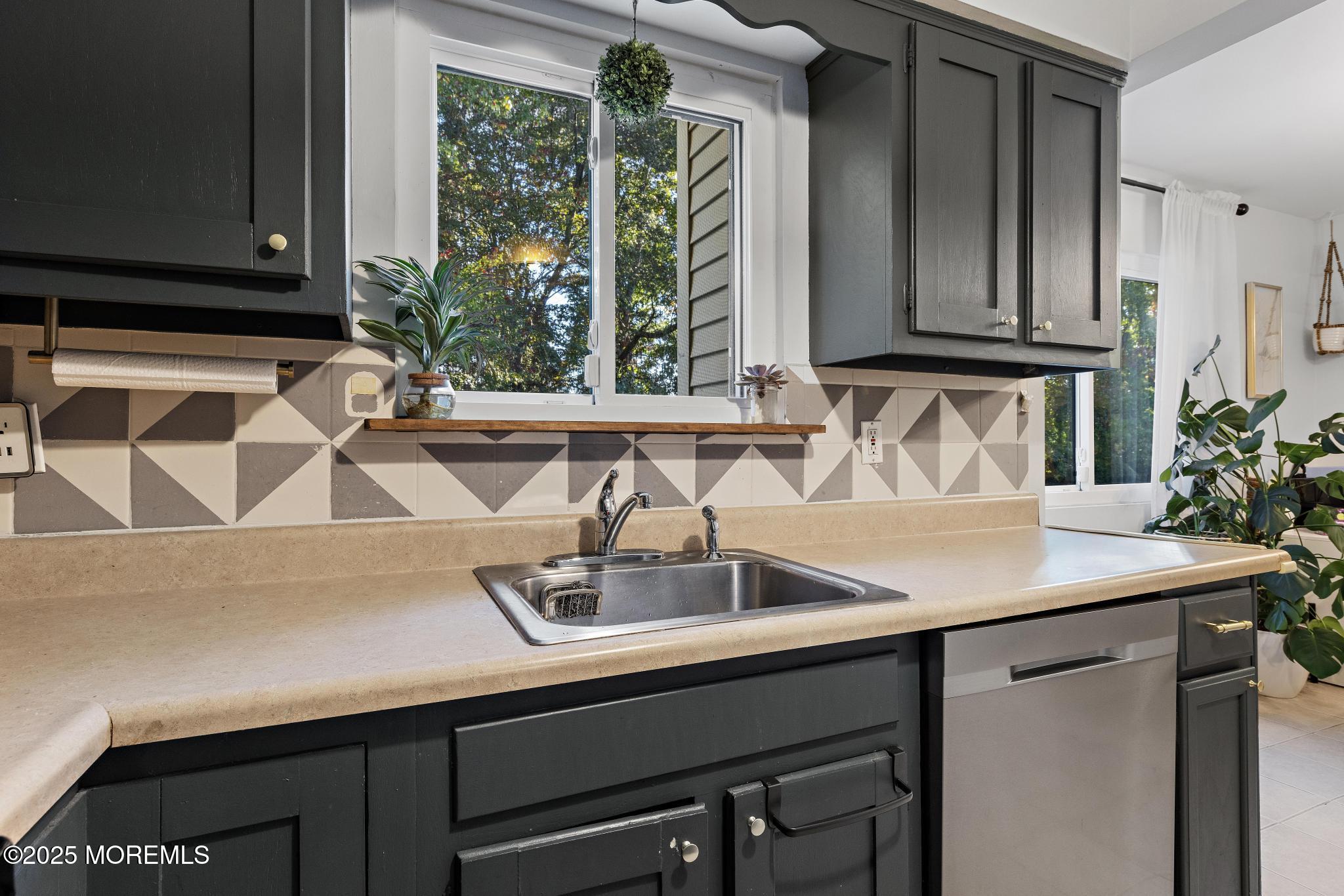 343 Middlewood Road Middletown, NJ 07748 - Photo 10 of 30 a kitchen with a sink and a window