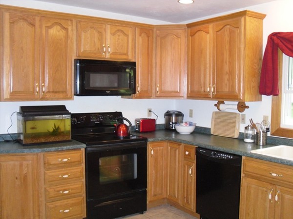 17 Chesterfield Road Worcester, MA 01602 - Photo 3 of 16 a kitchen with stainless steel appliances granite countertop a stove a sink and a microwave