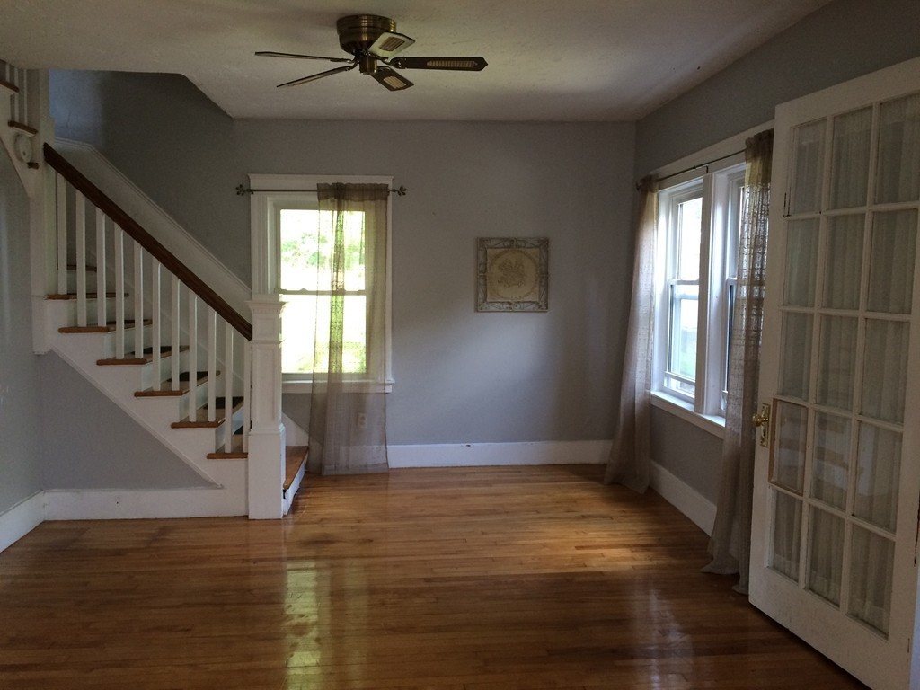 17 Chesterfield Road Worcester, MA 01602 - Photo 7 of 16 a view of an empty room with wooden floor and fan