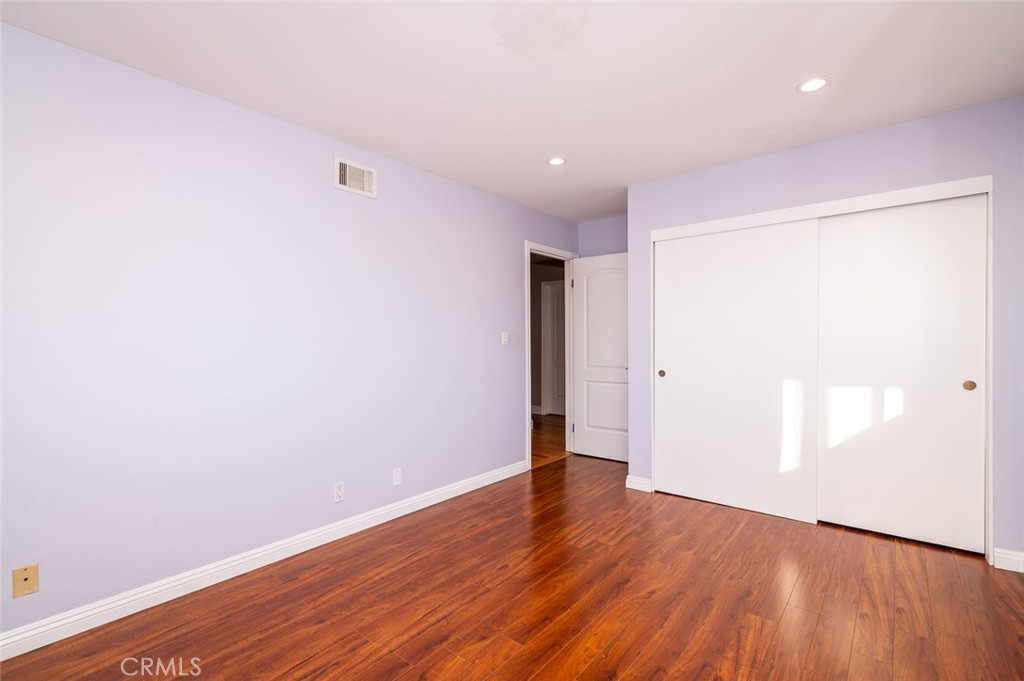 7117 Lonzo Street Tujunga, CA 91042 - Photo 22 of 49 a view of an empty room with wooden floor