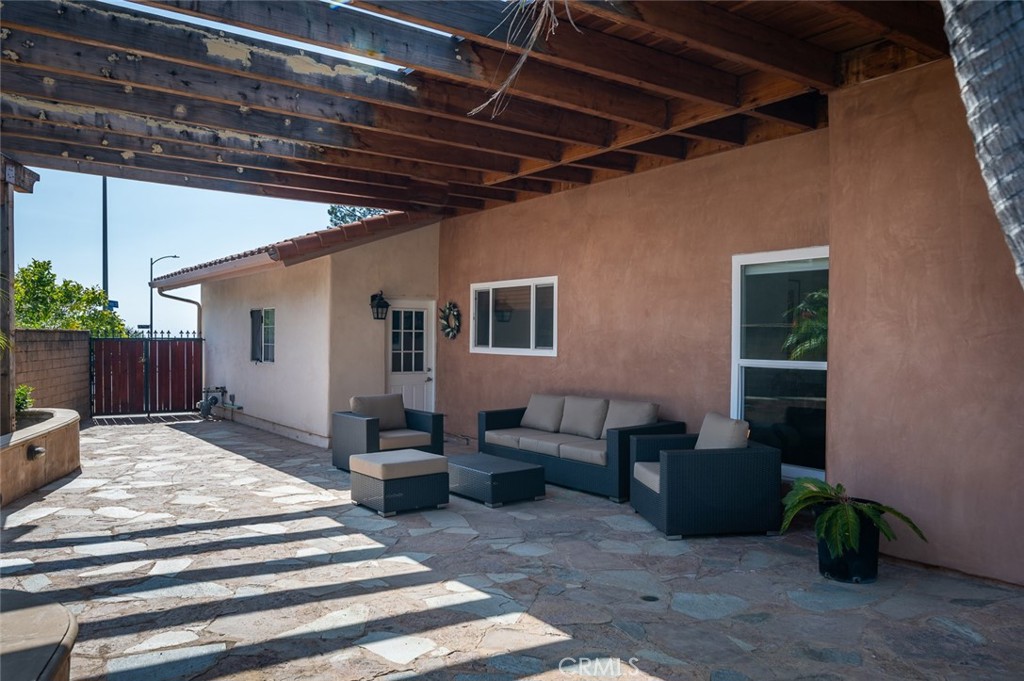 7117 Lonzo Street Tujunga, CA 91042 - Photo 42 of 49 a bedroom with furniture and a potted plant