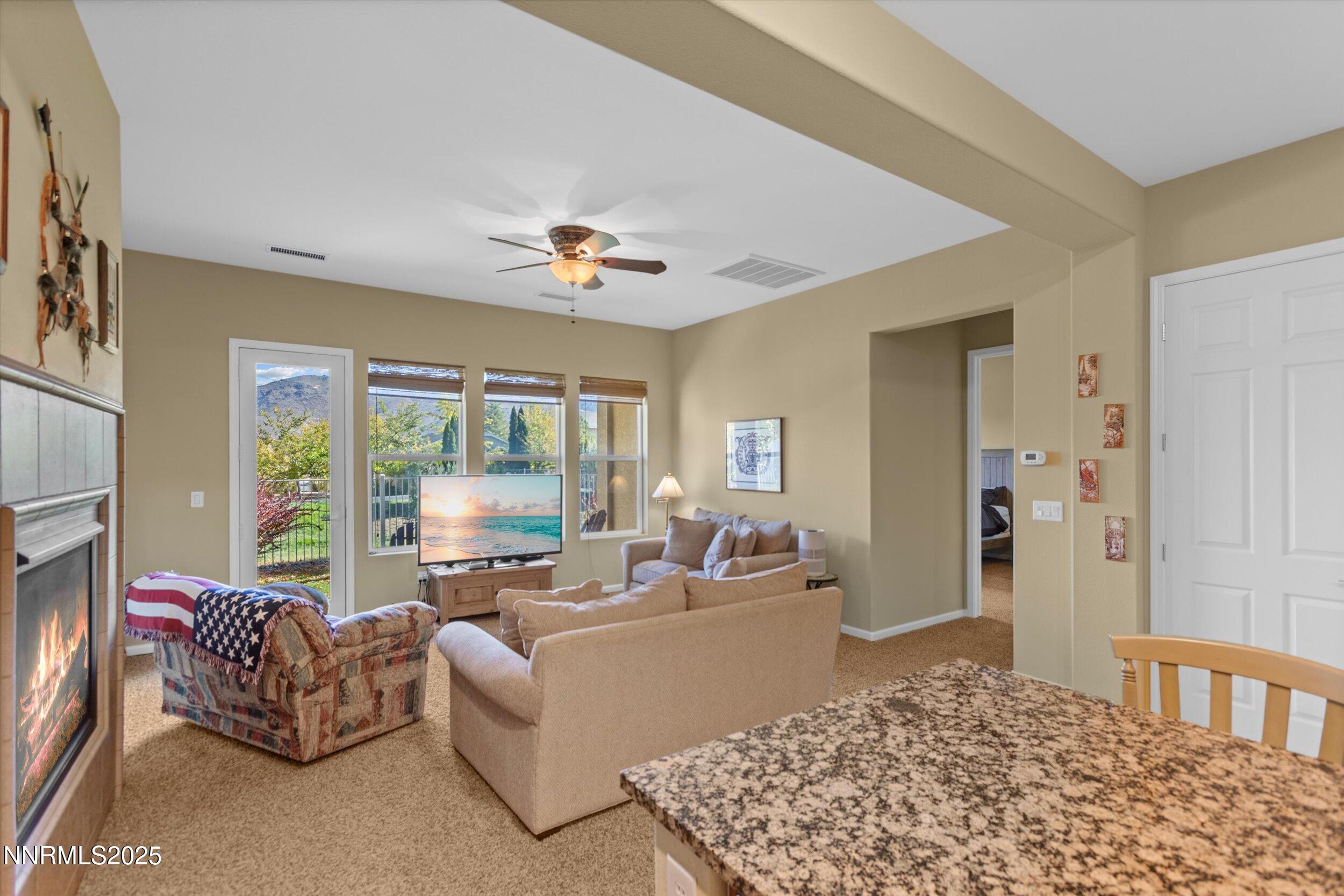 10900 Serratina Drive Reno, NV 89521 - Photo 15 of 47 a living room with furniture and a large window