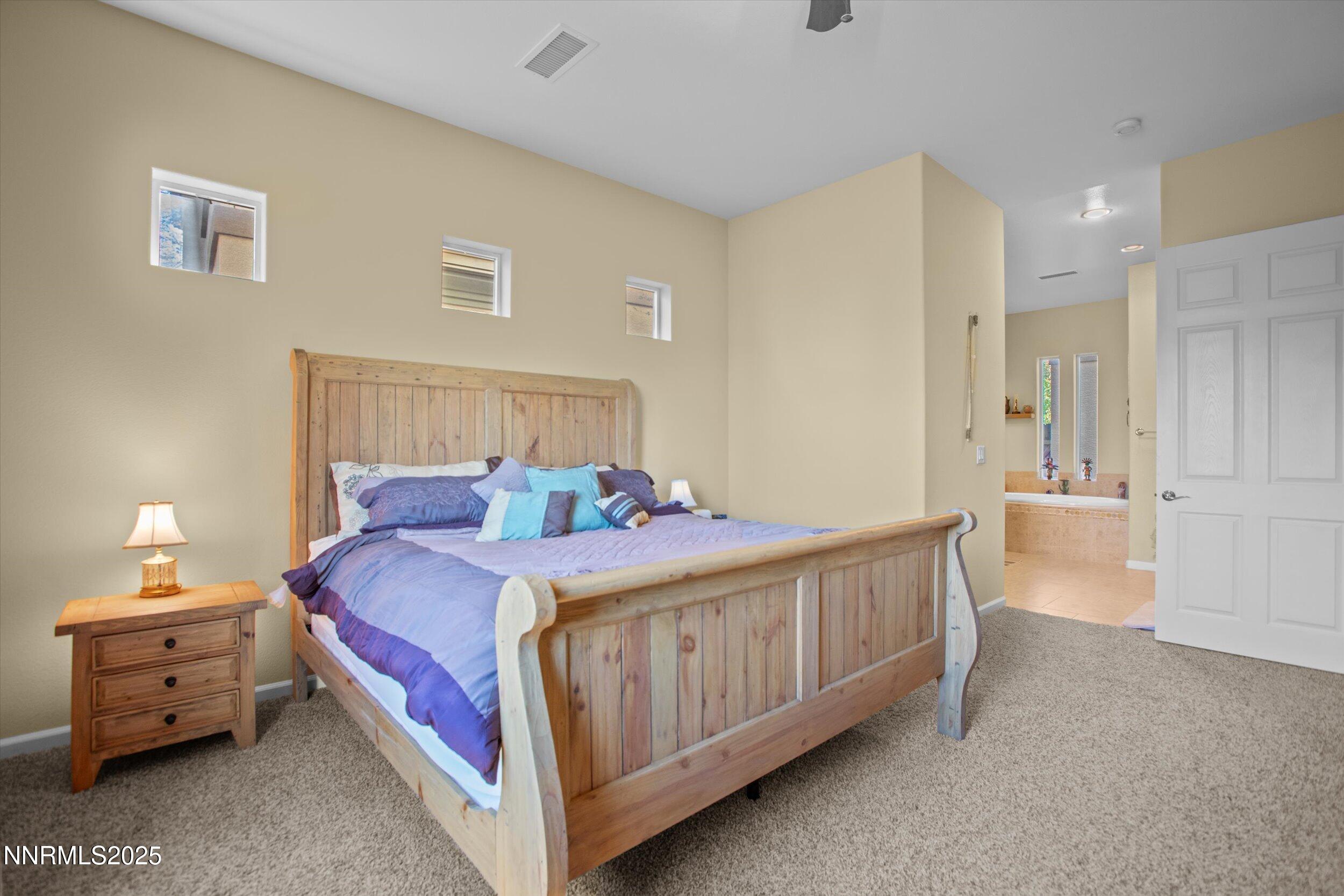 10900 Serratina Drive Reno, NV 89521 - Photo 19 of 47 a bed room with a bed and a couch