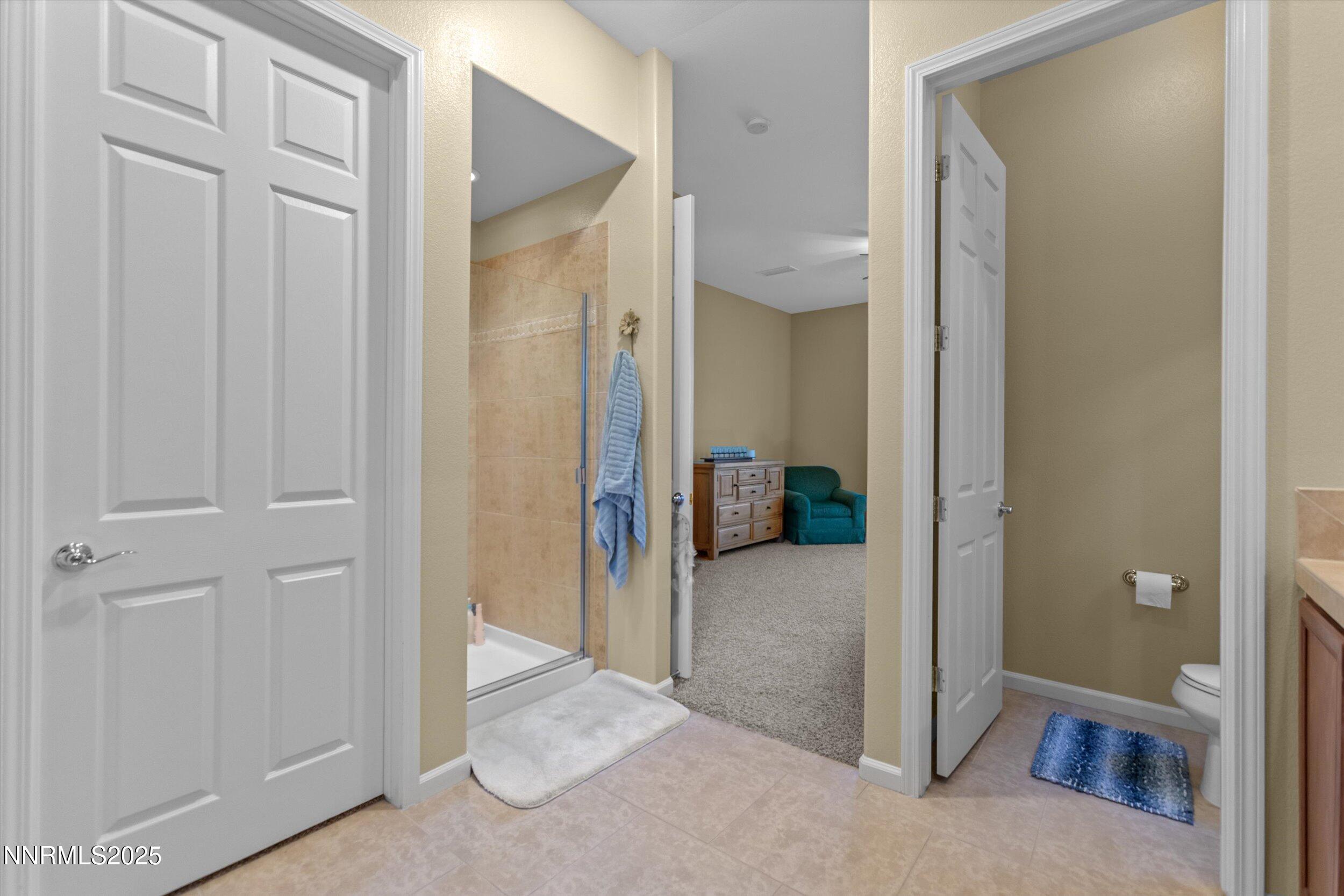 10900 Serratina Drive Reno, NV 89521 - Photo 22 of 47 a view of a livingroom and a bathroom