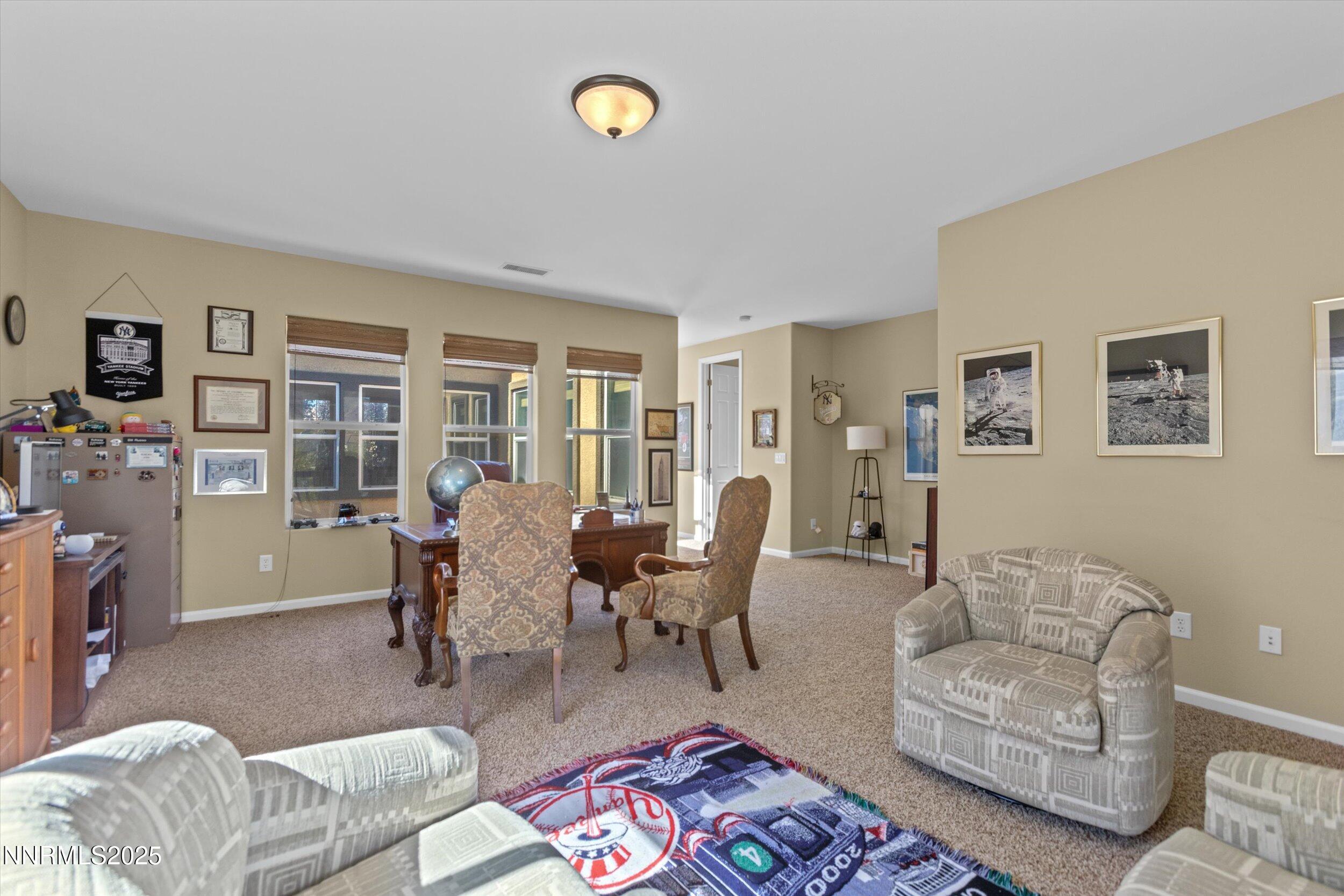 10900 Serratina Drive Reno, NV 89521 - Photo 31 of 47 a living room with furniture and a table