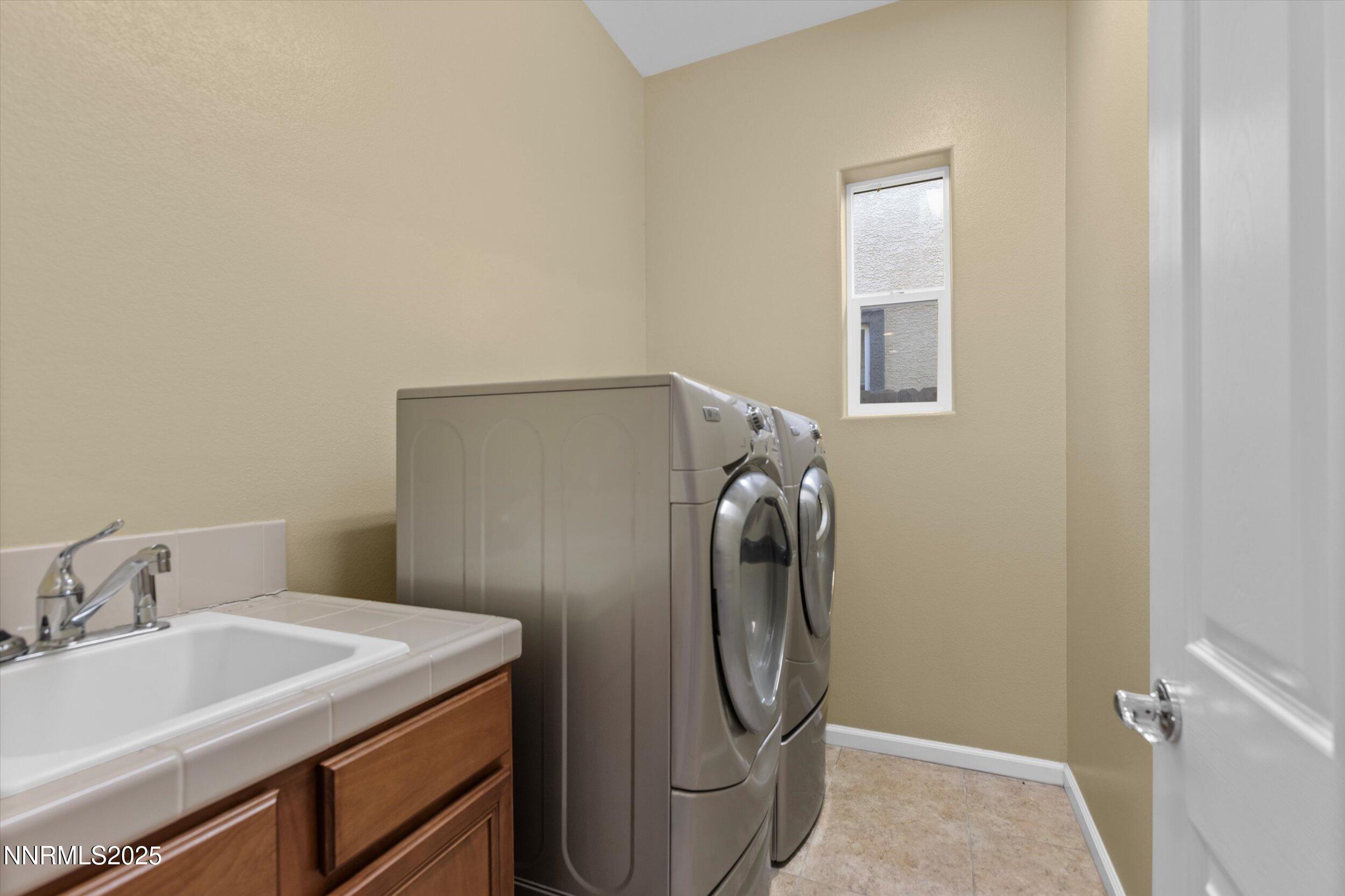 10900 Serratina Drive Reno, NV 89521 - Photo 35 of 47 a bathroom with a sink and a mirror