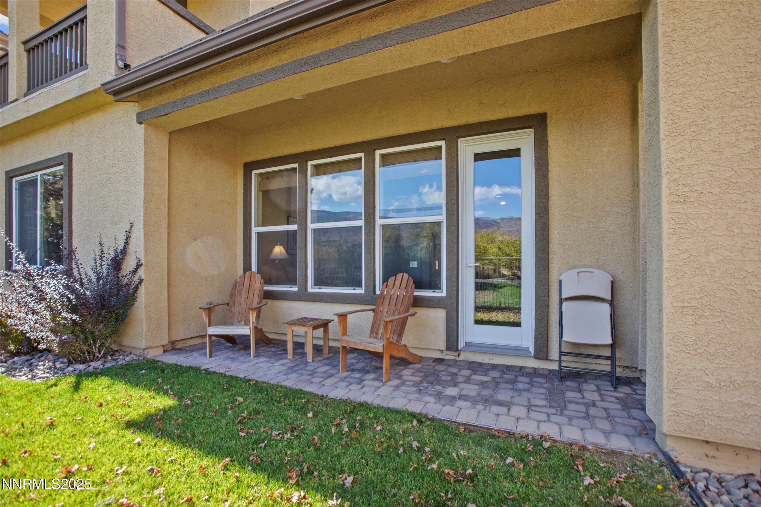 10900 Serratina Drive Reno, NV 89521 - Photo 40 of 47 a view of a house with backyard porch and sitting area