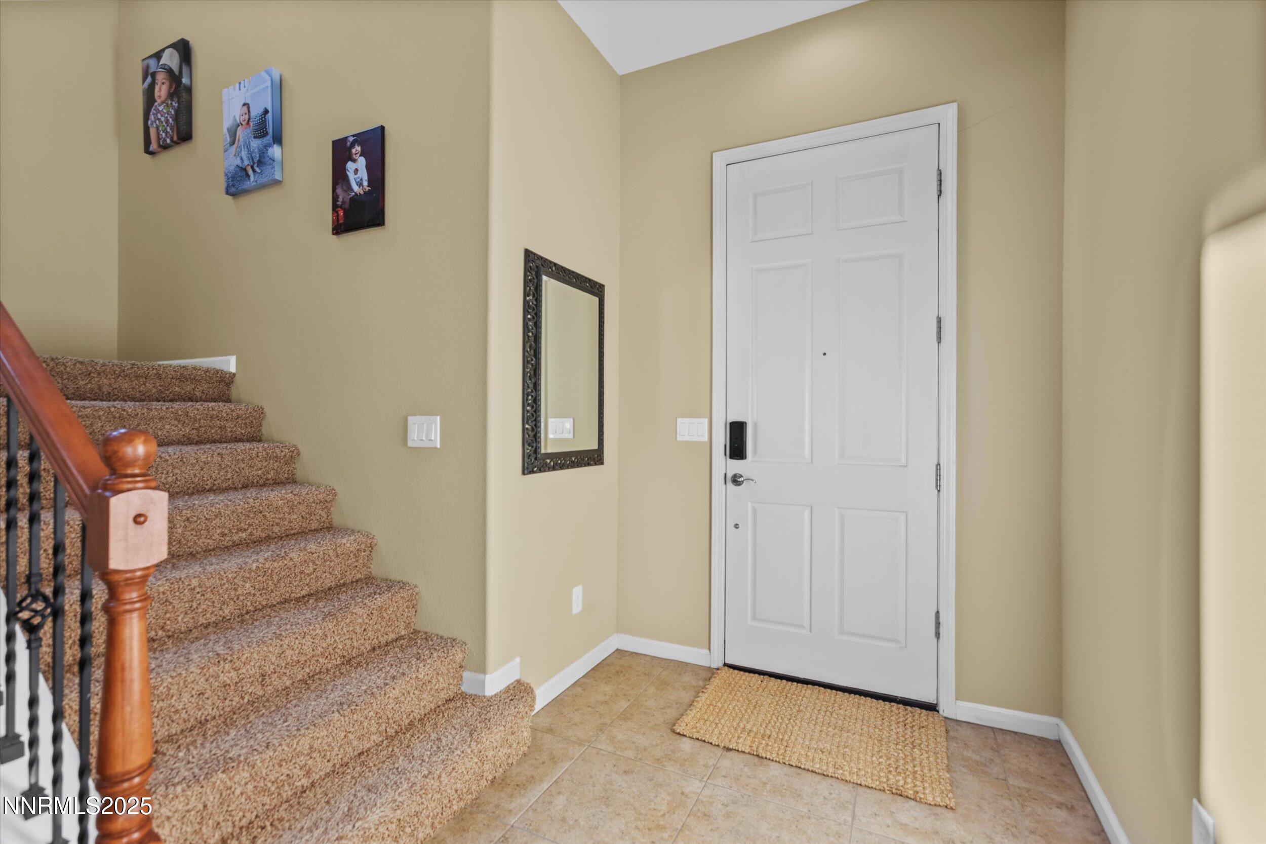 10900 Serratina Drive Reno, NV 89521 - Photo 4 of 47 a view of an entryway with wooden floor