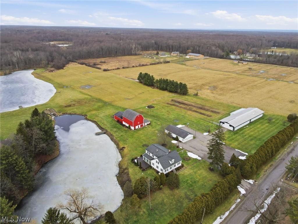 17452 Huntley Road Windsor, OH 44099 - Photo 6 of 49 Aerial view of sparsely populated area with a large body of water and a heavily wooded area