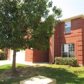 a front view of a house with yard