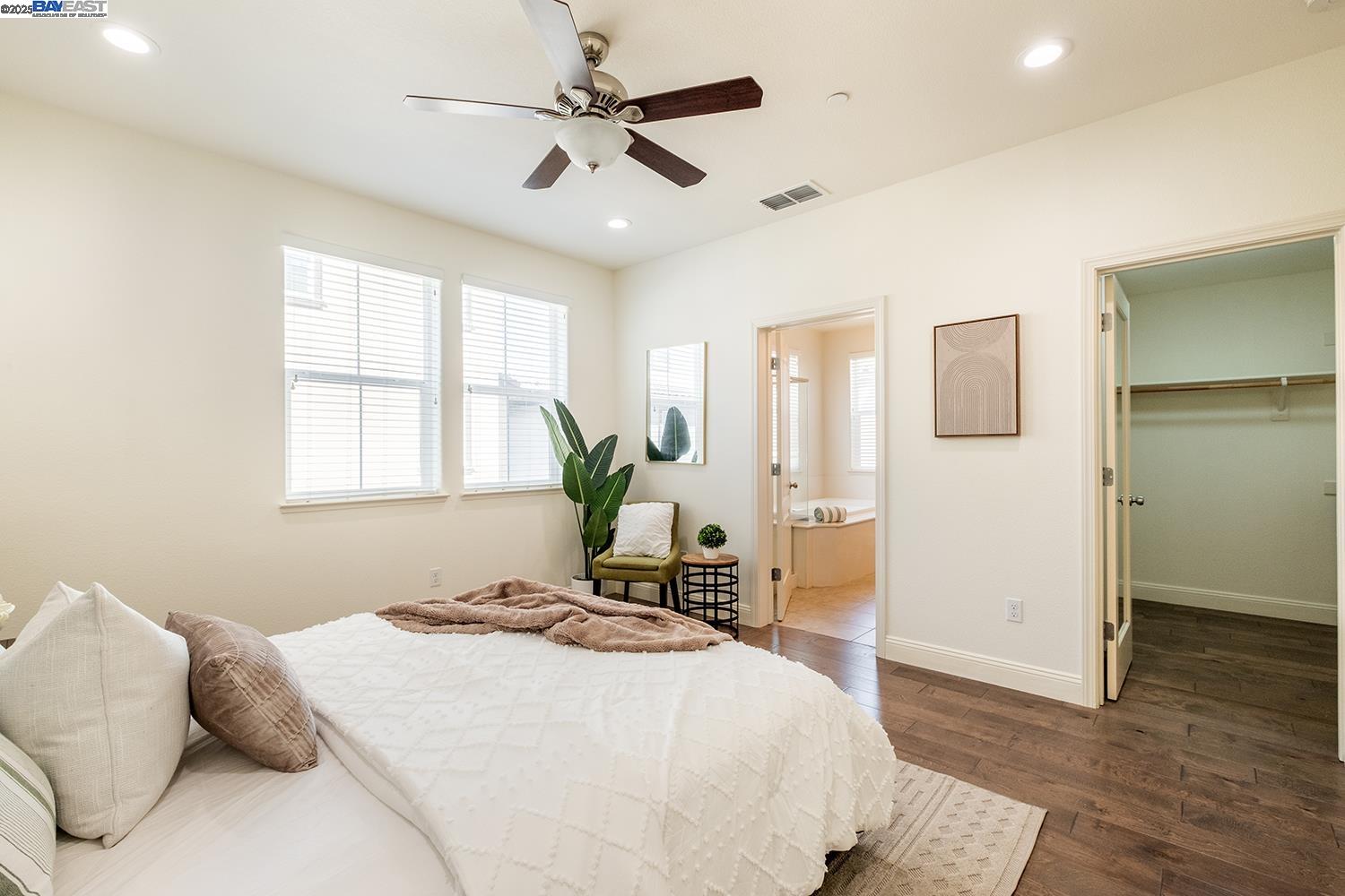 3135 Vittoria Loop Dublin, CA 94568 - Photo 15 of 38 a bedroom with a bed and wooden floor