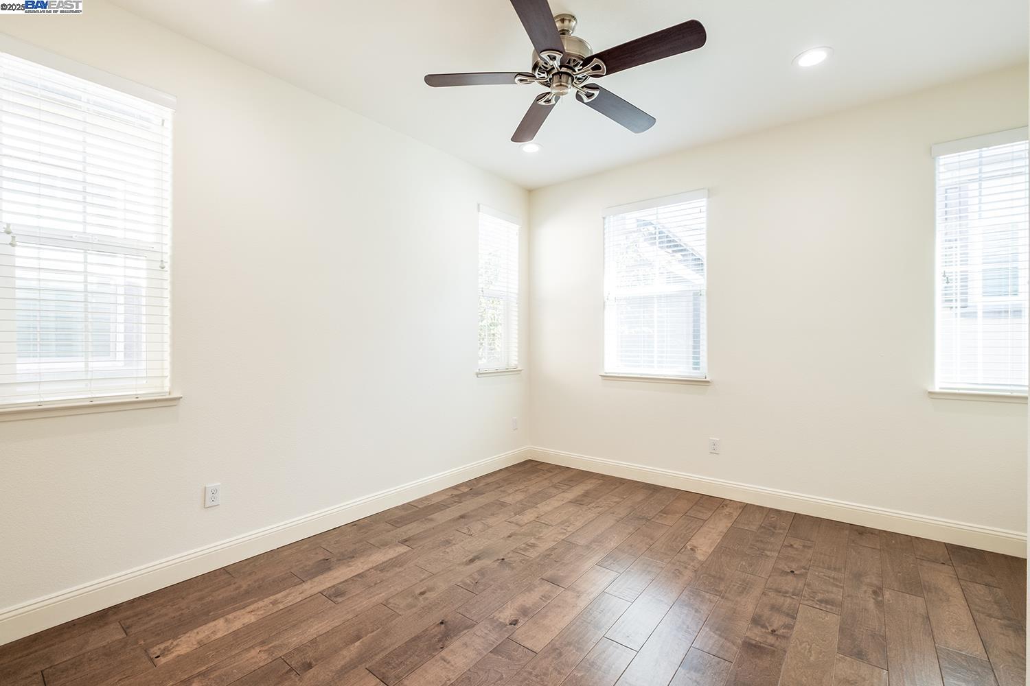 3135 Vittoria Loop Dublin, CA 94568 - Photo 18 of 38 wooden floor in an empty room with a window