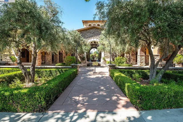 a front view of a building with a yard