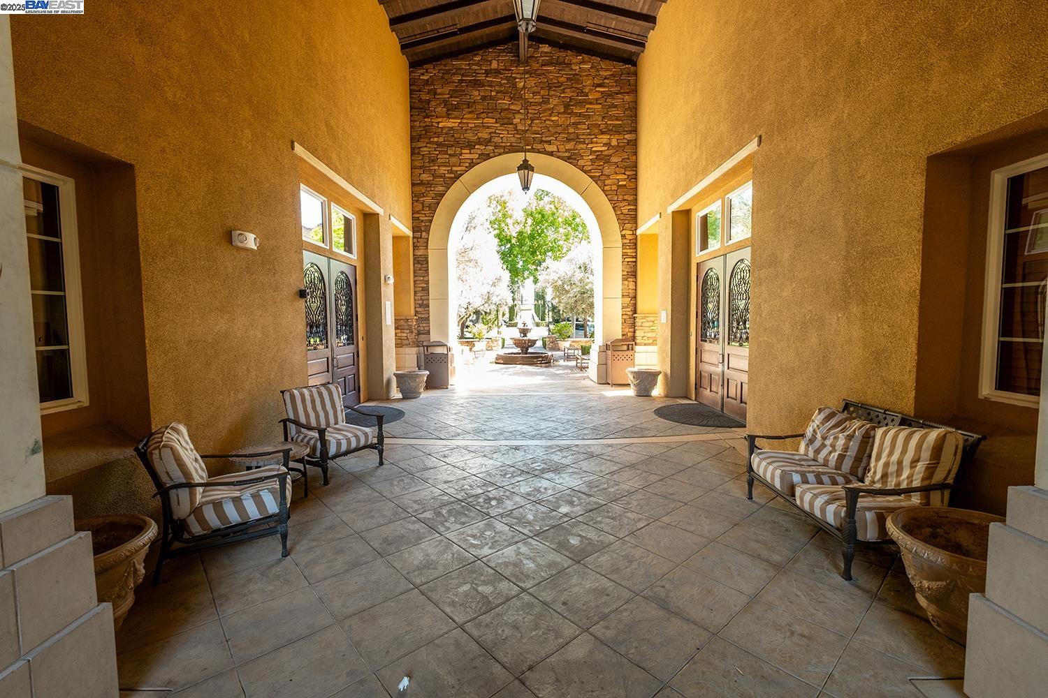 3135 Vittoria Loop Dublin, CA 94568 - Photo 29 of 38 a living room with furniture and a large window