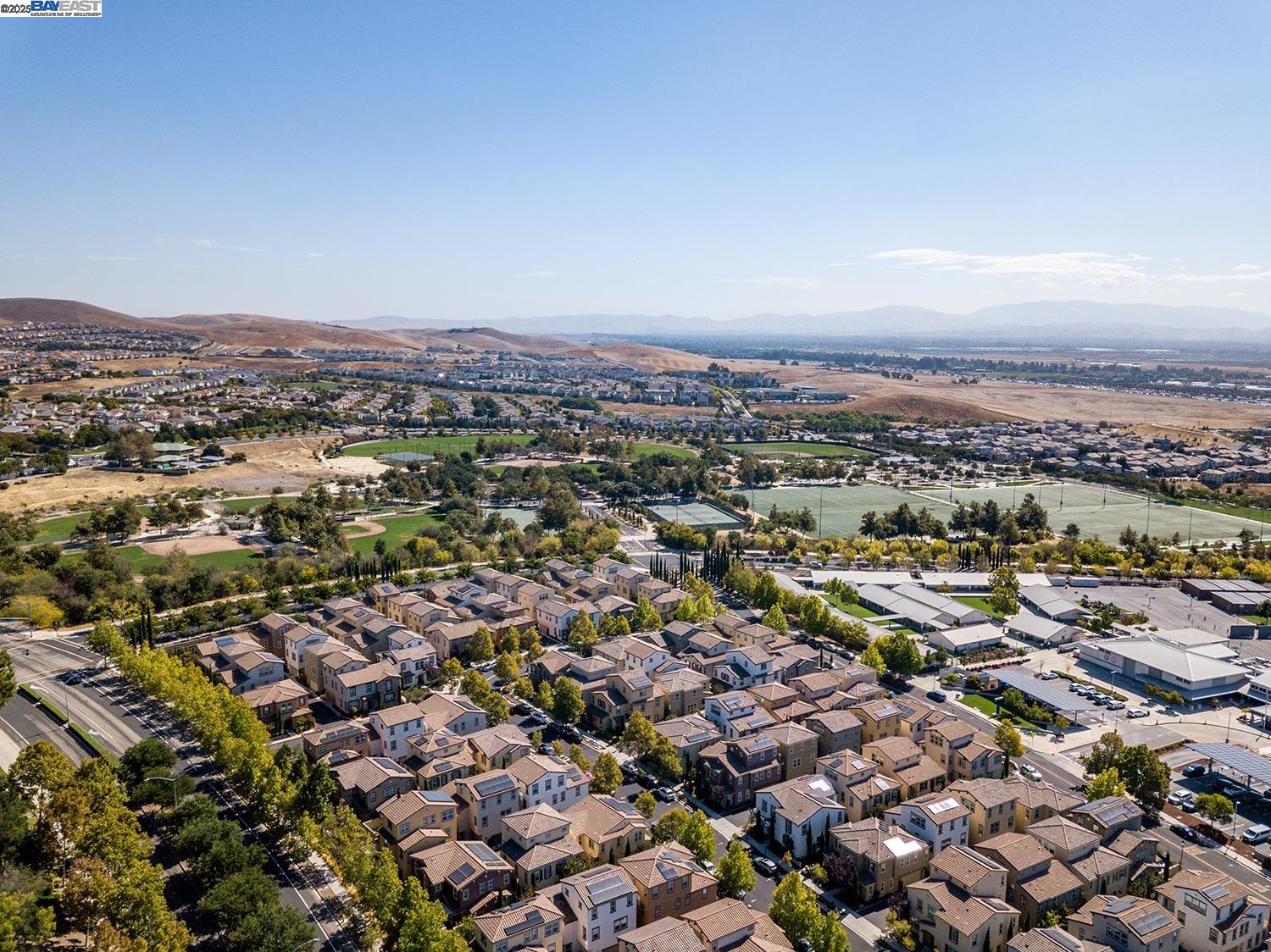 3135 Vittoria Loop Dublin, CA 94568 - Photo 36 of 38 an aerial view of a city with lots of residential buildings