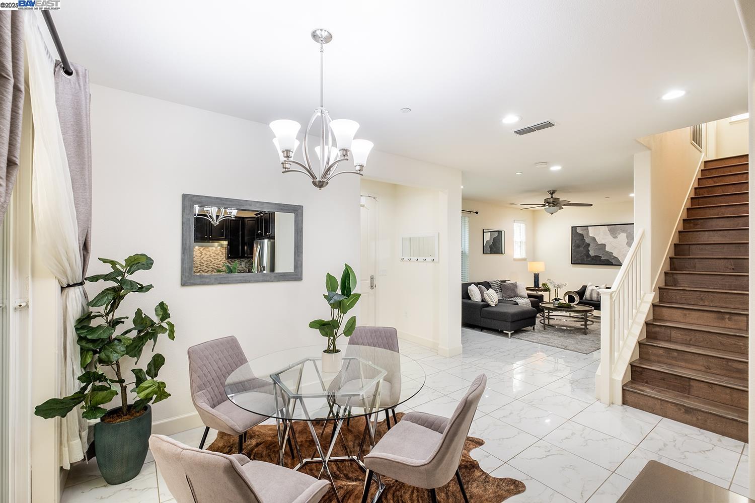 3135 Vittoria Loop Dublin, CA 94568 - Photo 4 of 38 a view of a dining room with furniture wooden floor and chandelier
