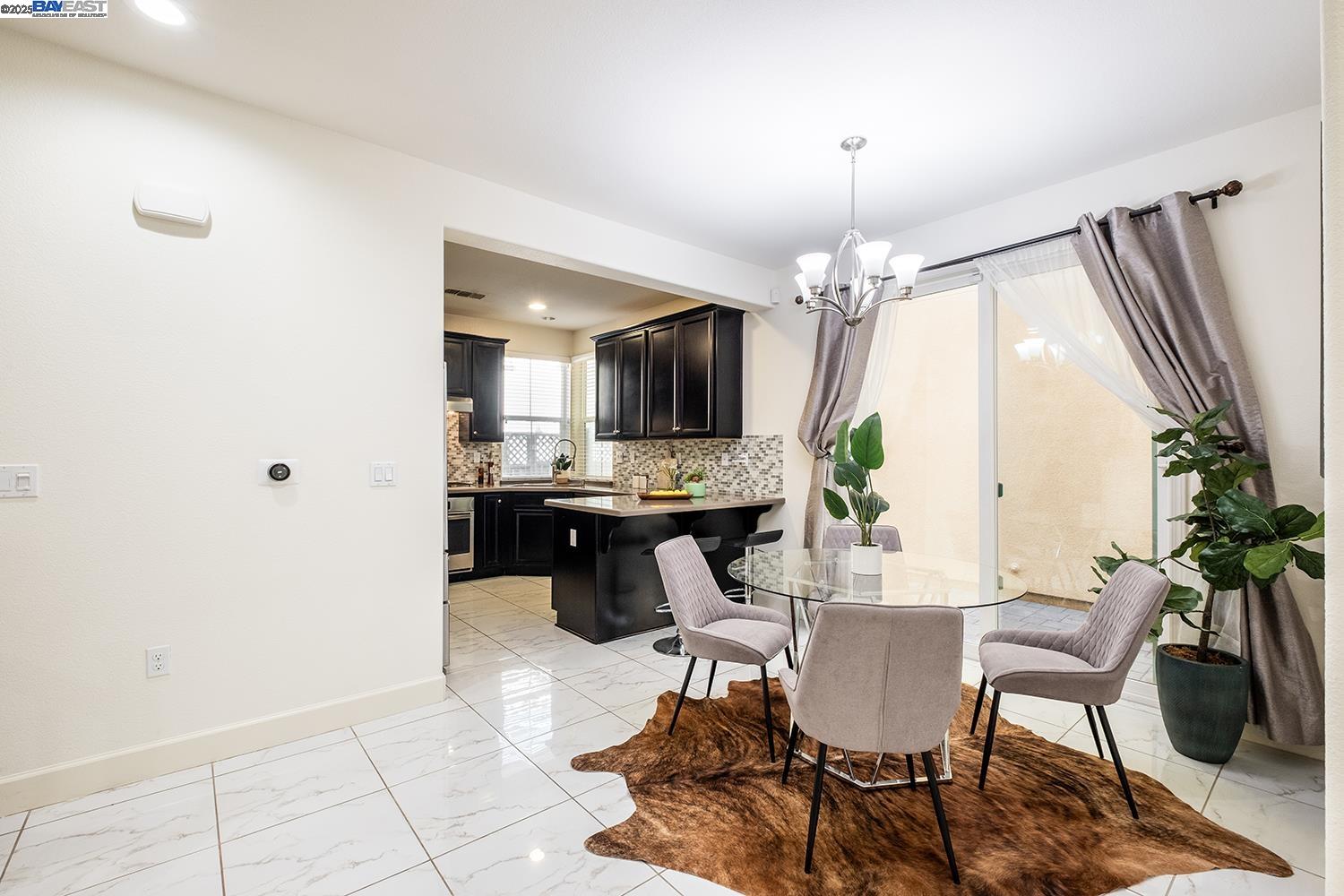 3135 Vittoria Loop Dublin, CA 94568 - Photo 8 of 38 a view of a livingroom with furniture and a potted plant