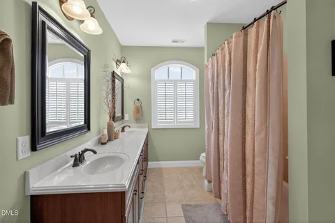 a bedroom with furniture and a chandelier