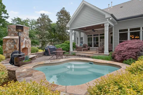 a view of a chairs and tables in the backyard