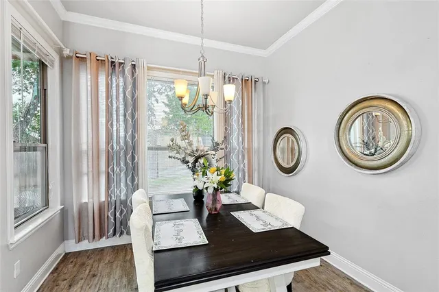 a view of dining room and wooden floor
