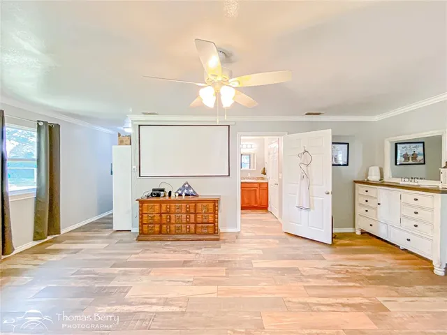 a view of a room with cabinet and mirrors