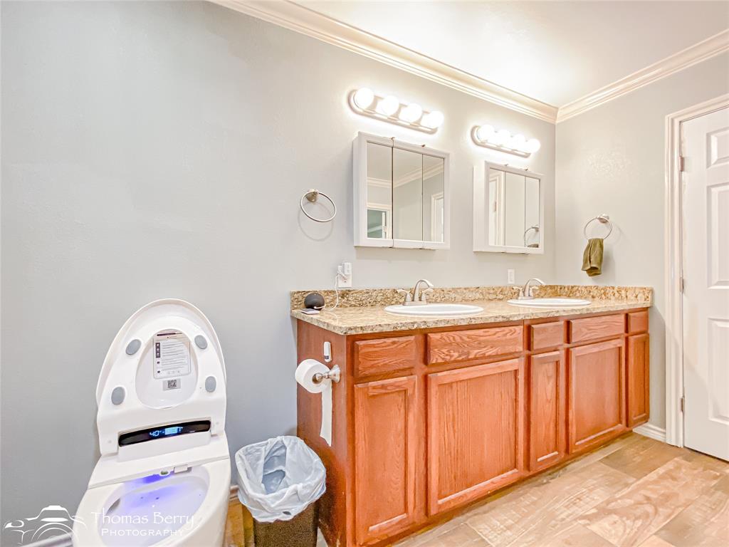 355 Farm To Market 604 Clyde, TX 79510 - Photo 18 of 30 a bathroom with a granite countertop sink and a mirror